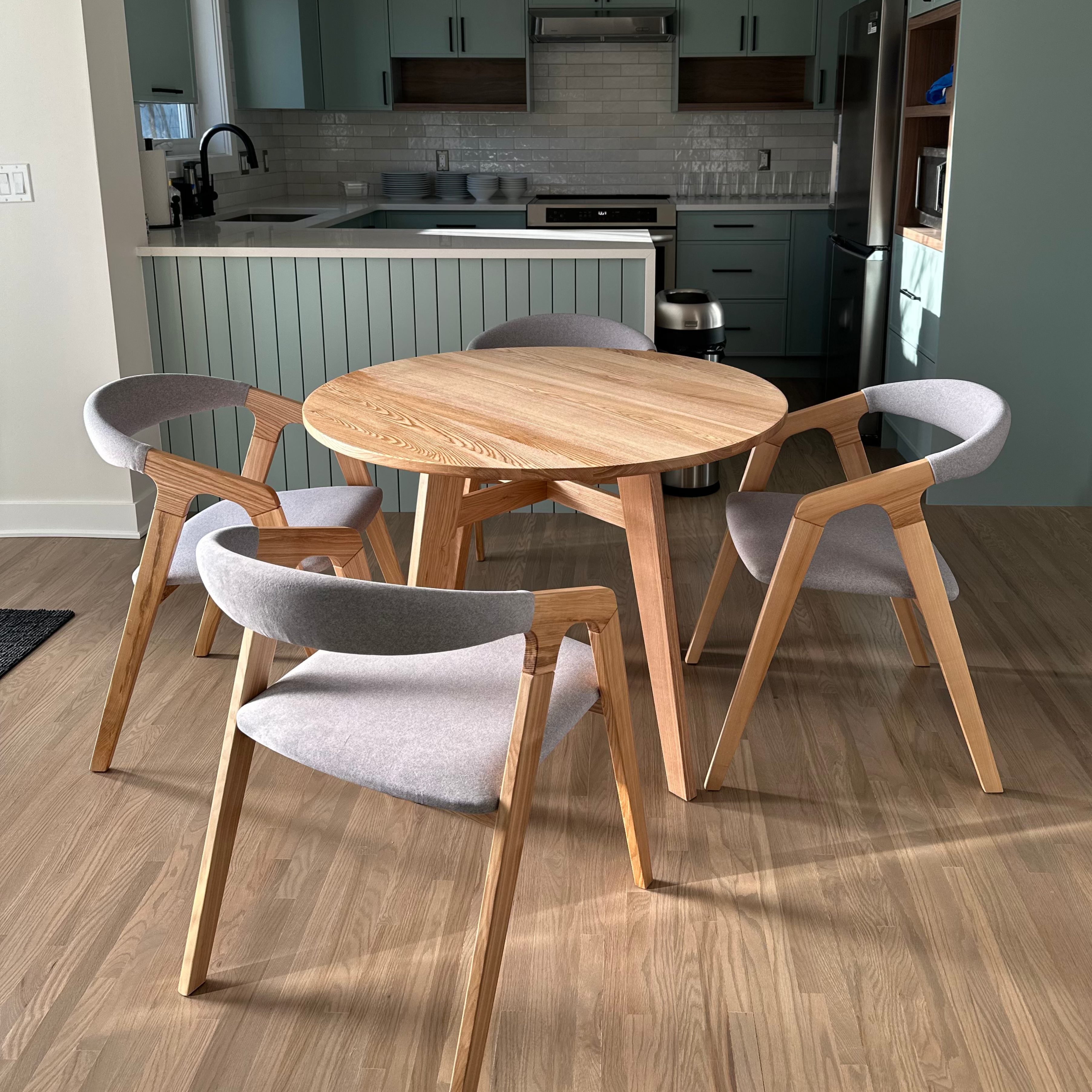 Bridge Dining Chair in Olive Ash with beige fabric seat in dining room