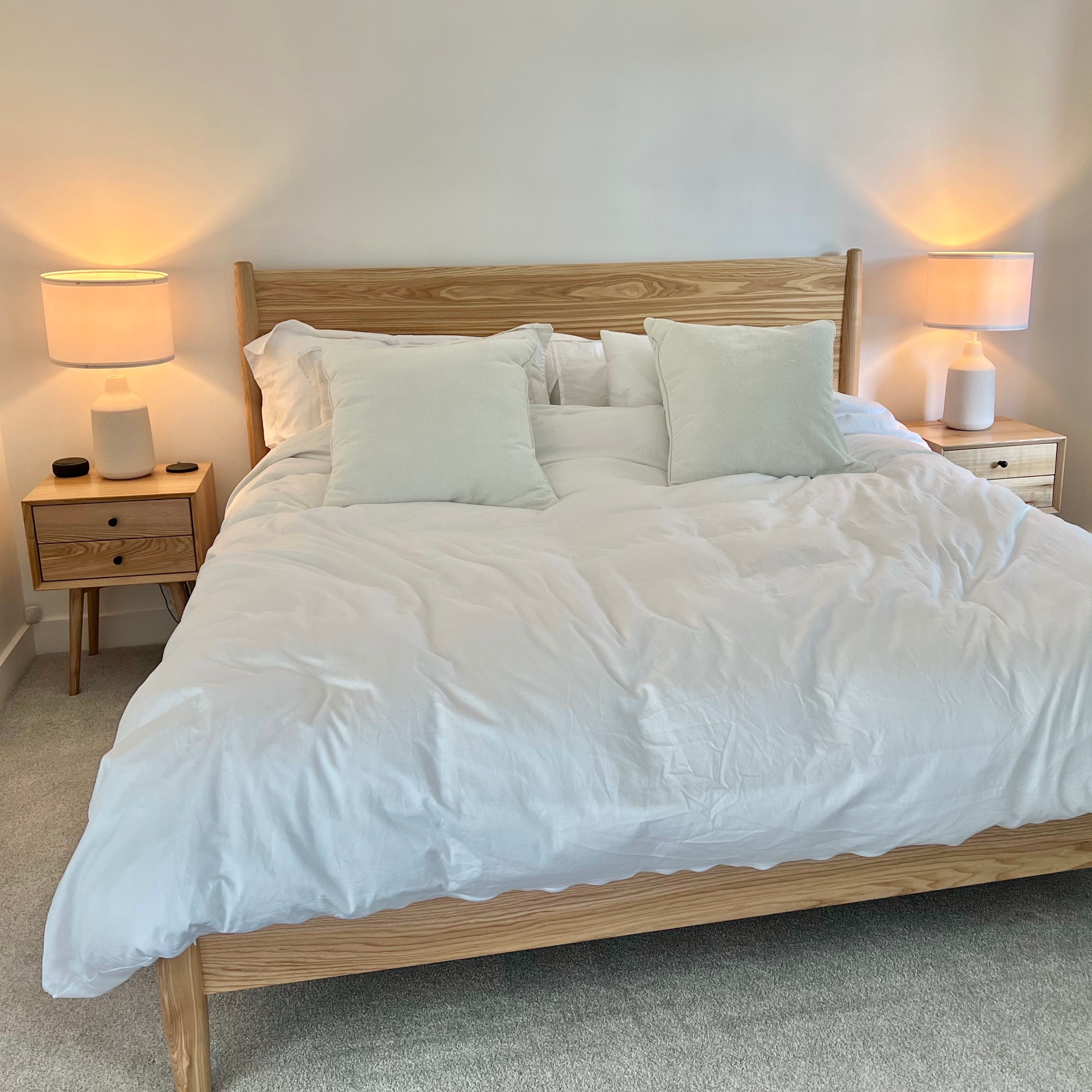Freedom nightstand — shown beside matching Freedom bed — bedroom lifestyle photo. Verdant Furniture.