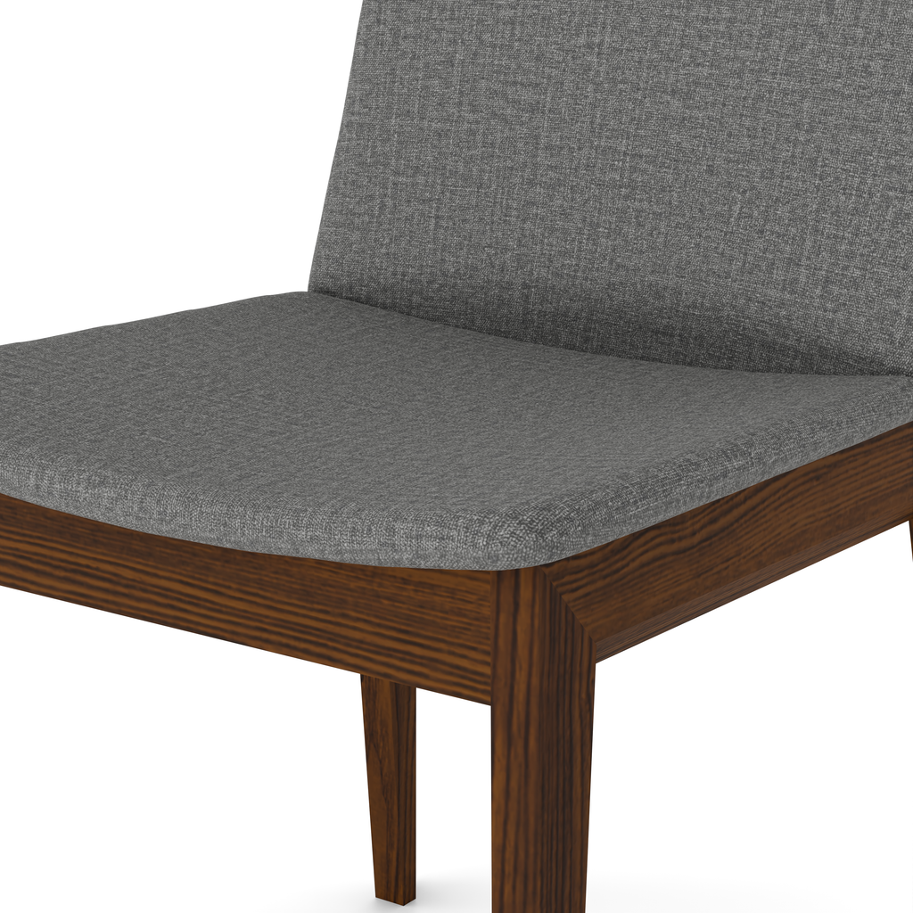 Detail of beige fabric and polished walnut edge