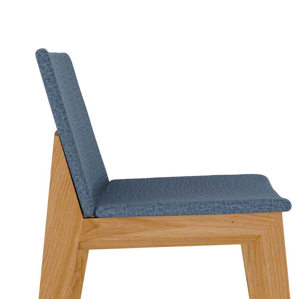 Detail shot showing oak joinery and textured charcoal fabric seat