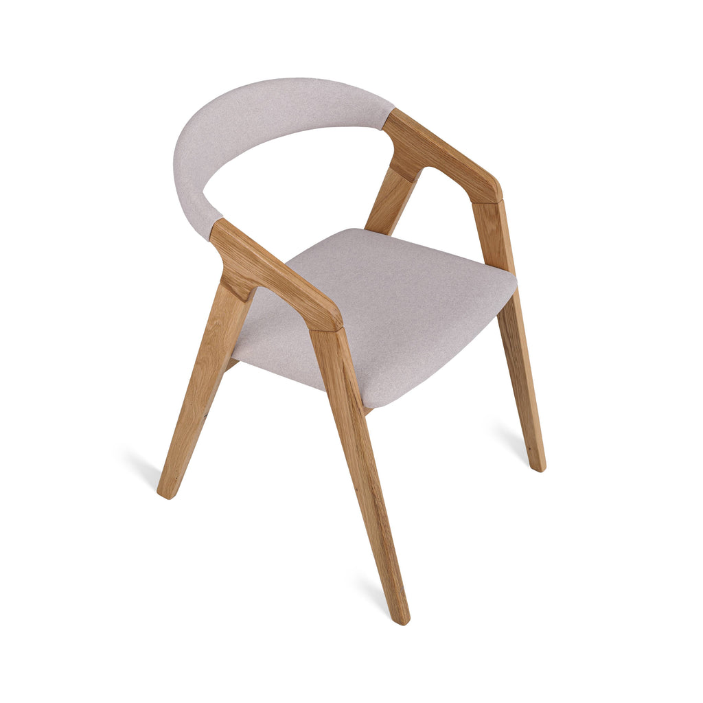 Angled shot – warm oak finish with beige fabric seat