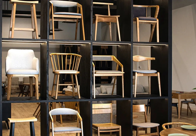 Verdant Furniture showroom display of wooden dining chairs and bar stools on modular shelving